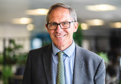 Chief Executive Bruce Moore smiles into the camera