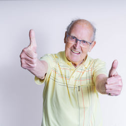 Resident smiling with thumbs up