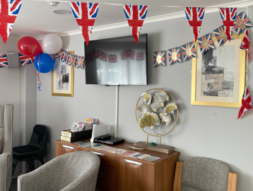 Residents' lounge and TV decorated with Union Jack bunting