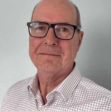A man in glasses and a chequered shirt