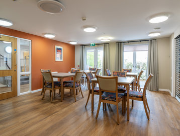 Tables and chairs in a communal dining room 