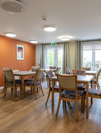 Tables and chairs in a communal dining room  