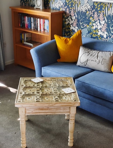 Guest room with sofa and table at Amos Court