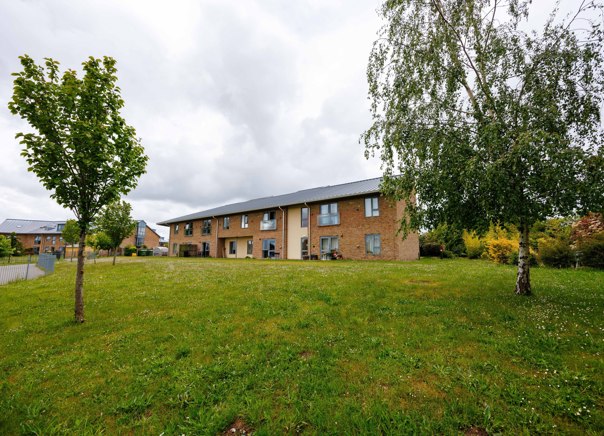 Green Lane View surrounded by landscaped grass area