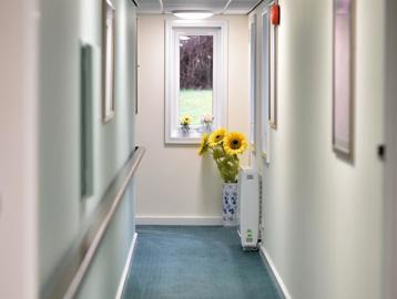 Looking down communal hallway at Alan Hilton Court