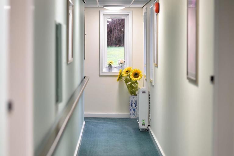 Looking down communal hallway at Alan Hilton Court