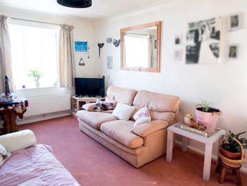 Inside living room of a resident's apartment with pink colour scheme