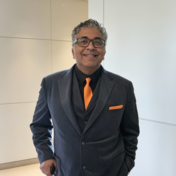 A smiling man in a suit