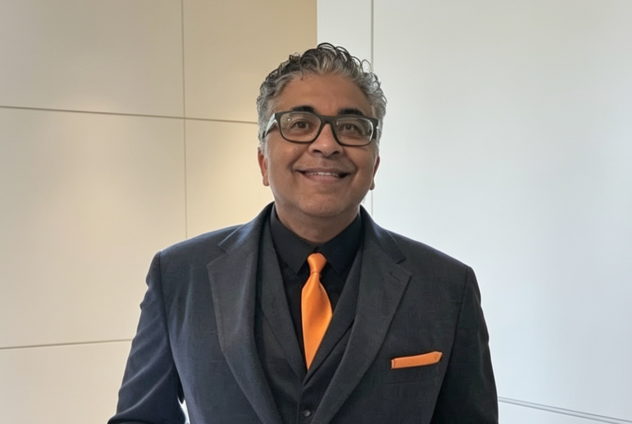 A smiling man in a suit