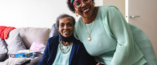 Two residents who are friends smiling 