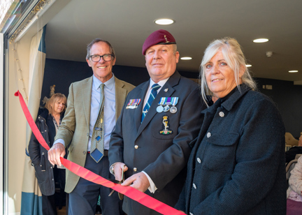 Housing 21's Chief Executive Bruce Moore with a Local Housing Manager and Resident doing a ribbon cutting