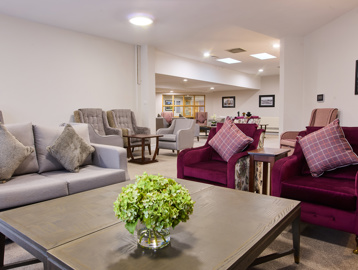 the scheme communal area with a table and chairs