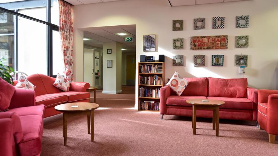 Resident's lounge area with library books