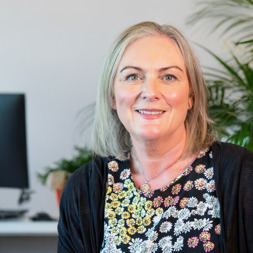 Lady in black outfit smiling