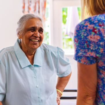 Resident socialising with employee