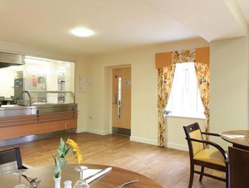 Cafe/bistro area with dining tables and chairs