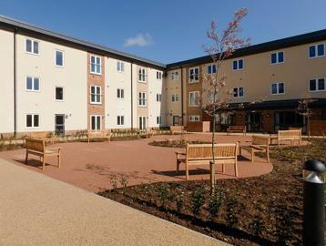 Large courtyard with benches outside Meadow Walk