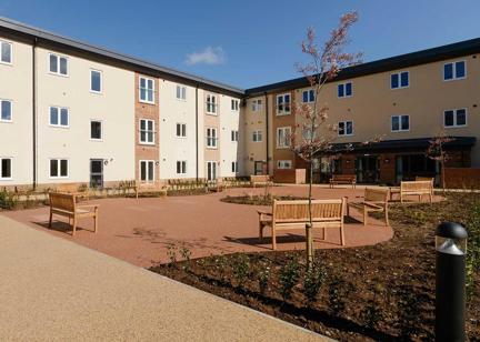 Large courtyard with benches outside Meadow Walk