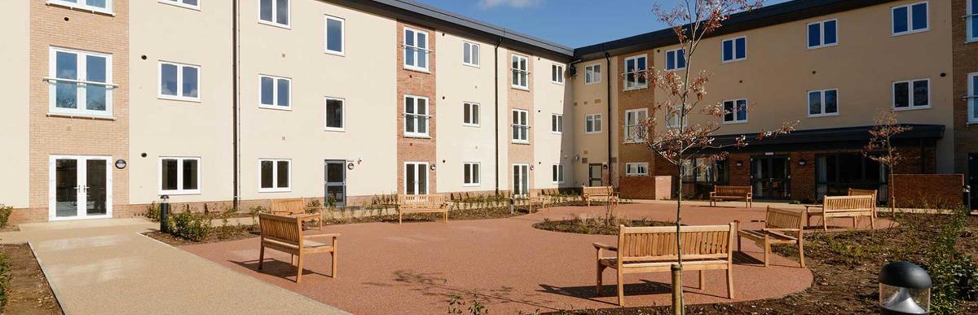 Large courtyard with benches outside Meadow Walk