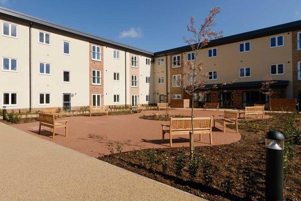 Large courtyard with benches outside Meadow Walk