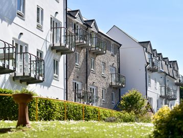 Side view of the building from the garden area on a sunny day