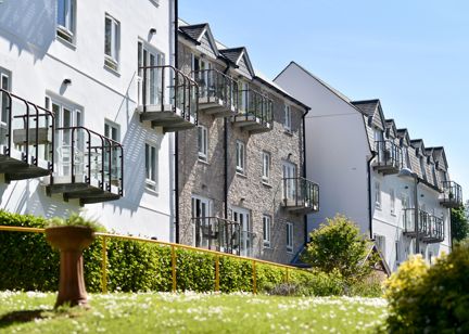Side view of the building from the garden area on a sunny day