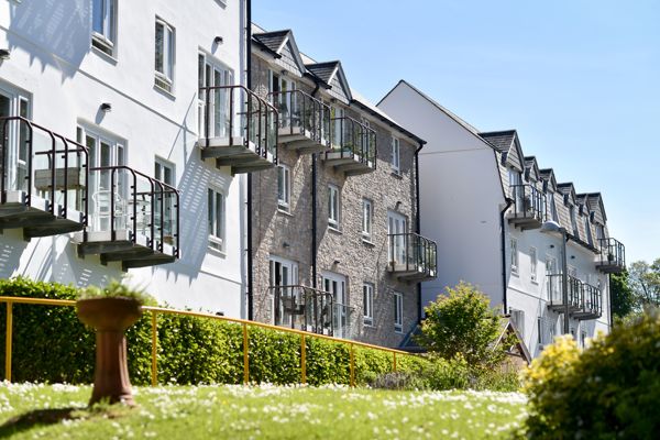Side view of the building from the garden area on a sunny day