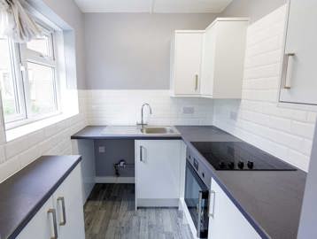 Small modern kitchen in an empty apartment