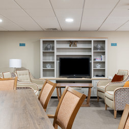 a communal lounge with media wall