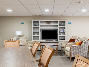 a communal lounge with media wall