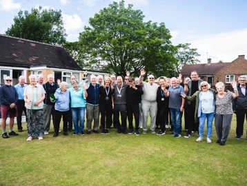 Group of residents smiling from Oldham