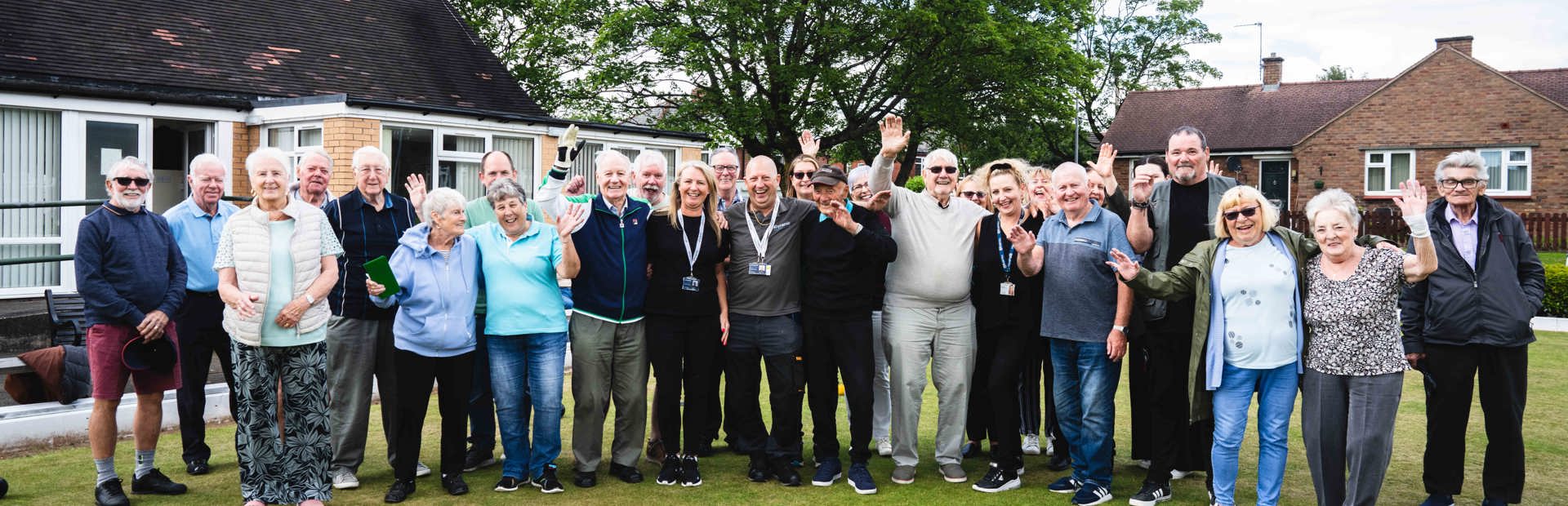 Group of residents smiling from Oldham