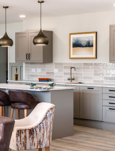 Communal kitchen area with modern units, seating and furnishings 