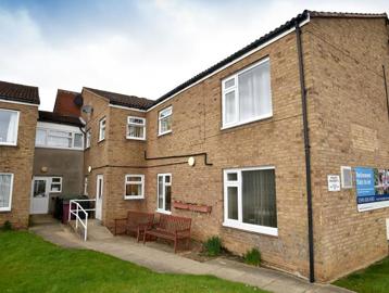 A photo outside of Fullylove Court with a ramp to the doorway