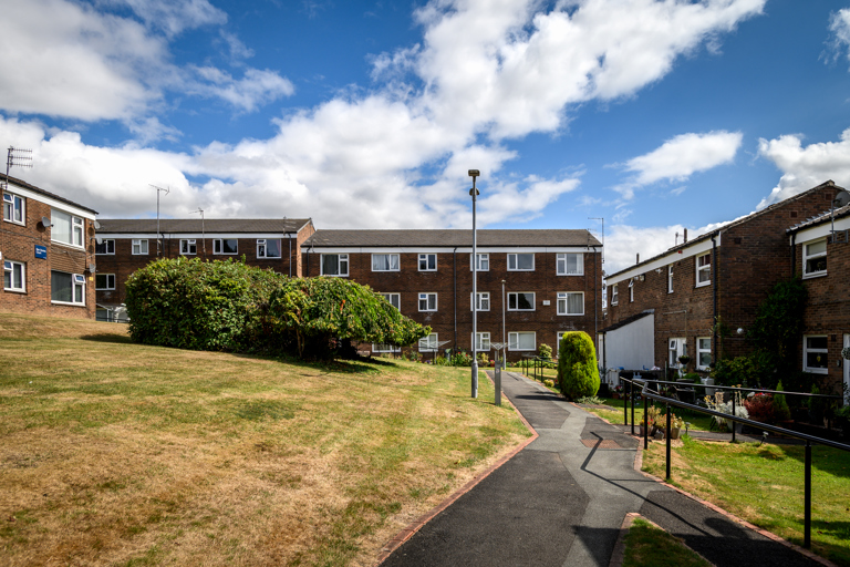 Block of apartments with outside grassy space