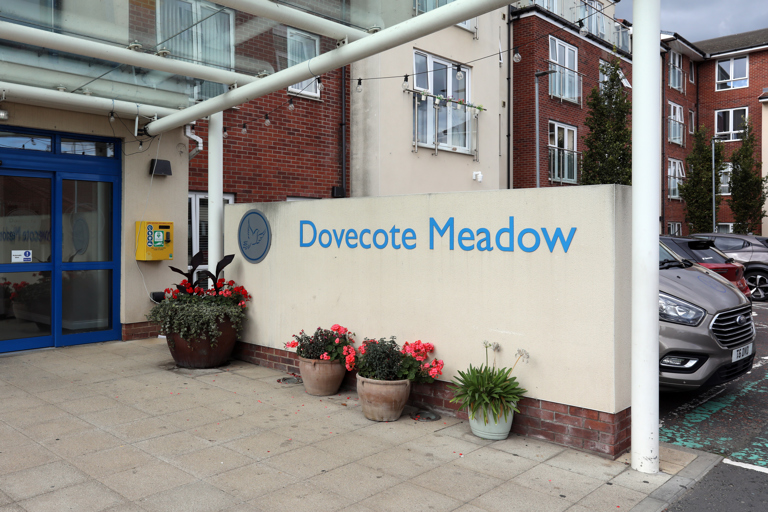 Entrance to Dovecote Meadow with sign.