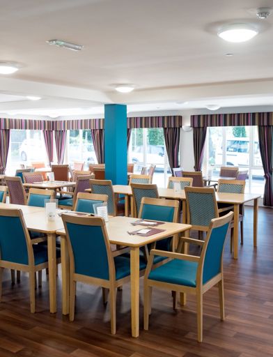 View of the large cafe/ bistro area with ample seating and tables 