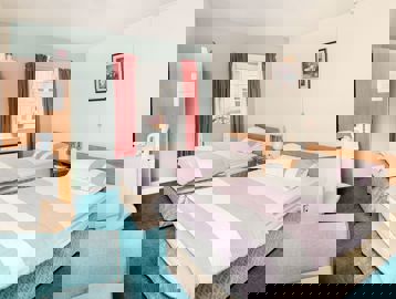 Two single beds in the bedroom of an apartment