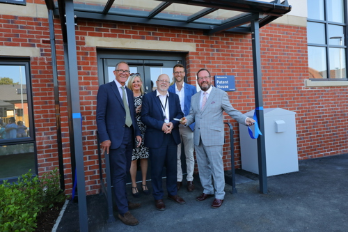 Bruce More, Chief Executive at Housing 21, Pam Mastrantonio, Executive Director for Retirement Living, Deputy Mayor and Cabinet Member for Housing and Business at City of Doncaster Council, Cllr Glyn Jones, Executive Director at Henry Riley, Dan Macpherson, Stephen Hughes, Chair at Housing 21 outside Patent House after the ribbon cutting..