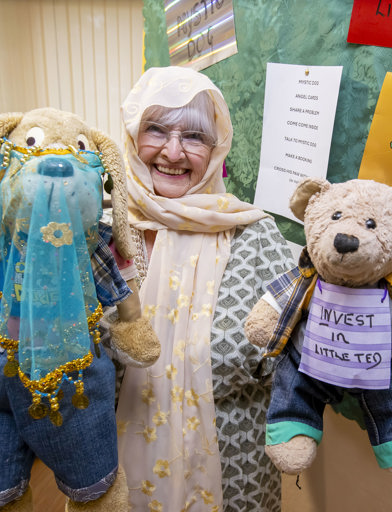 Female resident holding two teddy bears 