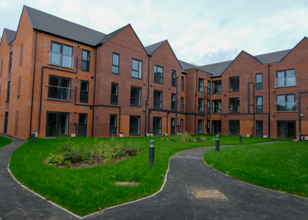 The back outer building of Askern Vale Court with a small back garden