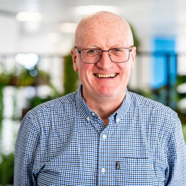 Housing 21 Board Member, Richard Dell, smiles into the camera