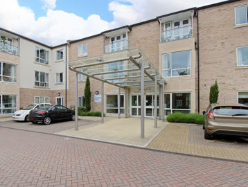Main entrance to Handyside Court with car parking either side