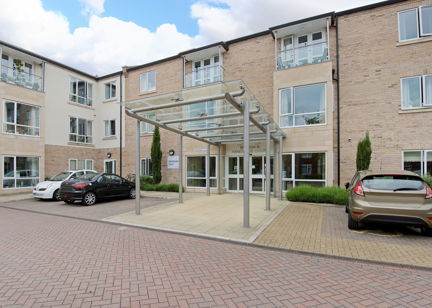 Main entrance to Handyside Court with car parking either side