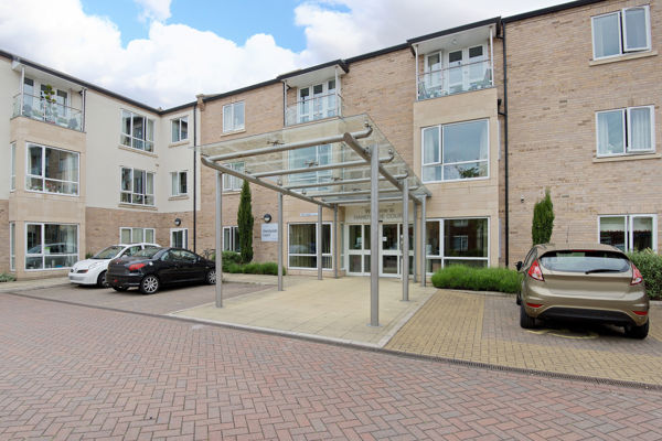 Main entrance to Handyside Court with car parking either side