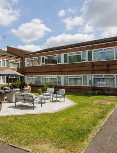 Gardens with seating area at Carne-Rasch 