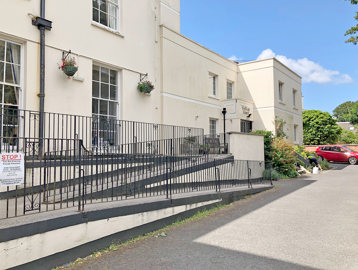 Three-tier ramp to the front entrance of the scheme from off the carpark