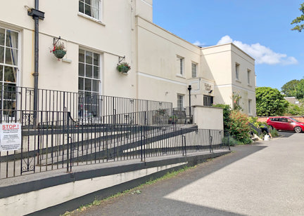 Three-tier ramp to the front entrance of the scheme from off the carpark