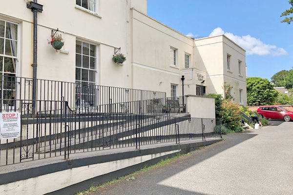 Three-tier ramp to the front entrance of the scheme from off the carpark
