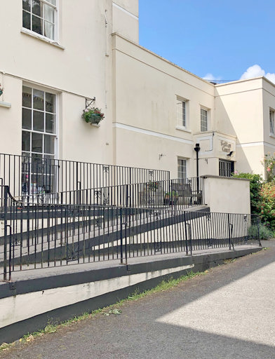 Three-tier ramp to the front entrance of the scheme from off the carpark 